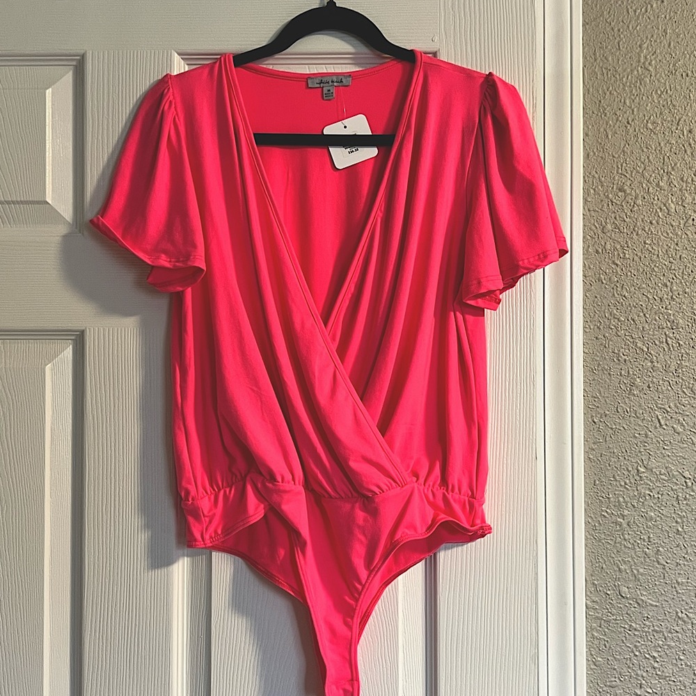 Brand new with tags. Hot pink bodysuit by White Birch